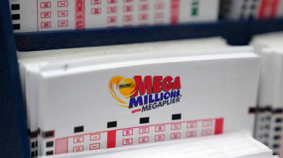 A display holds Mega Million lottery ticket wagering cards