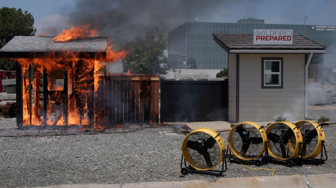 The Institute for Business & Home Safety conducts a side-by-side burn demonstration of a conventionally built structure and a Wildfire Prepared structure.