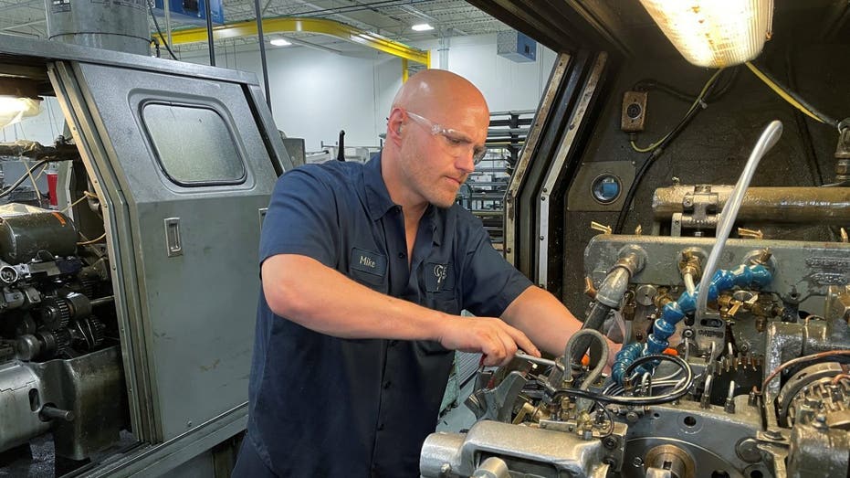 Worker operating a machine